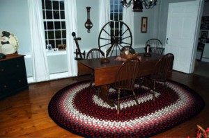 Marge Yonda - hand crated braided wool rug in room setting 