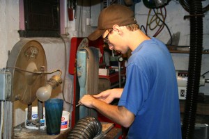 Knife maker Stacy J. Nabinger working on sanding blade